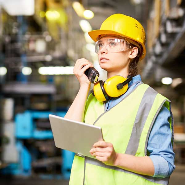 safety and ppe worker in warehouse walkie talkie